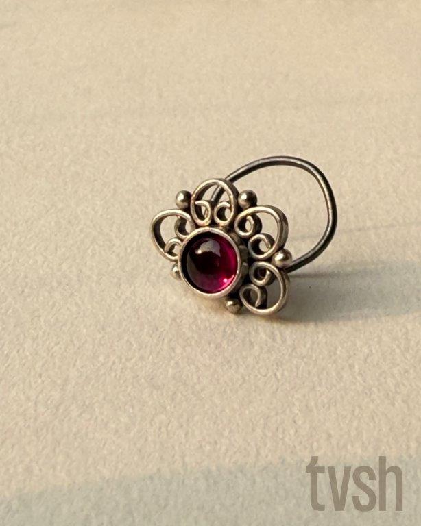 Silver wired nose pin with a semiprecious red stone
