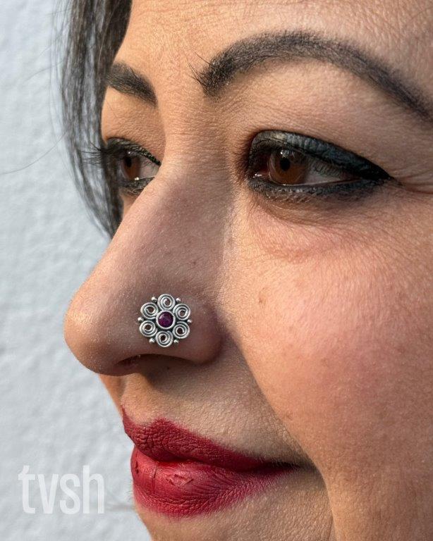 Double layered flower silver wired nose pin with a small red stone