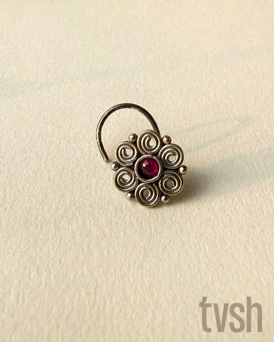 Double layered flower silver wired nose pin with a small red stone
